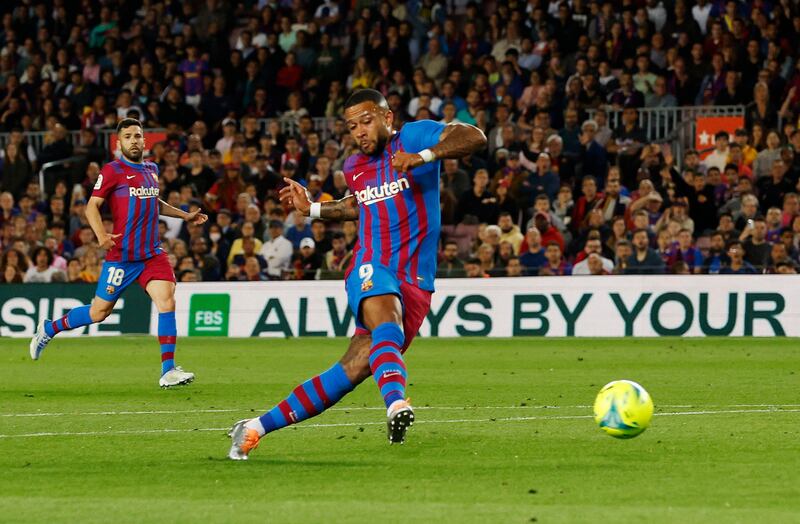 Barcelona's Memphis Depay scores against Celta Vigo. Reuters