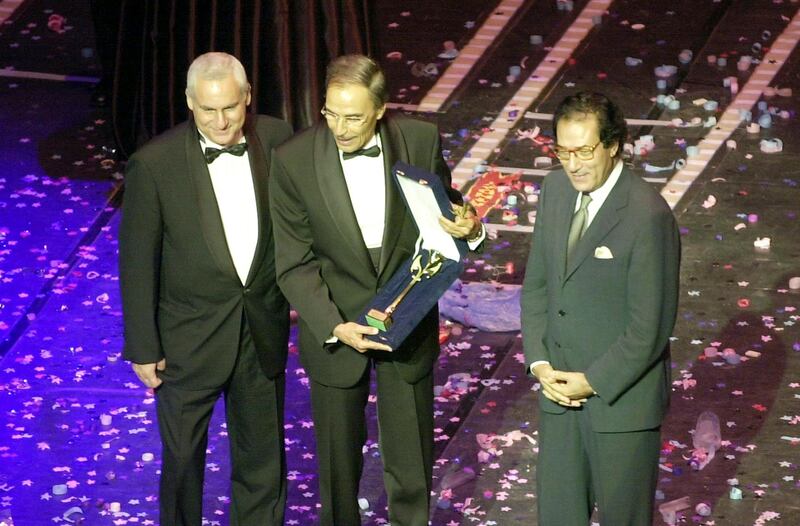 Veteran Egyptian actor Ezzat al-Alayli (C) receives an honorary award from Egyptian Culture Minister Faruq Hosni (R) and the president of the Cairo International Film Festival, Sherif al-Shubashi, during the opening ceremony of the festival at the Opera House in Cairo late 15 october 2002. The 10-day festival, which opened with Ahmad Zaki's latest film "Maali al-Wazir" (The Minister), is dedicated to the late film star and "symbol of the Egyptian cinema" Suad Hosni who died in London last year. (Photo by KHALED DESOUKI / AFP)