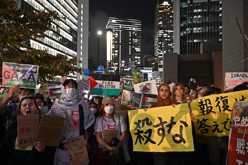 Protesters gather near the US embassy in Tokyo, Japan, to show solidarity with Palestinians in Gaza. AP