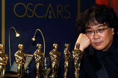 Bong Joon-ho poses with the many Oscars 'Parasite' won, while at the Governors Ball following the 92nd Academy Awards in Los Angeles. Reuters 