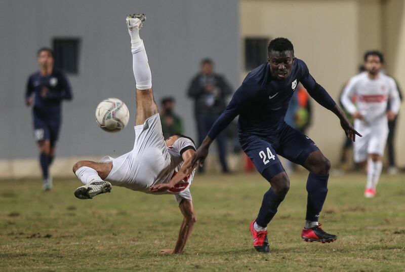 Zamalek player Ahmed Fatouh (L) attempts a bicycle kick next to Enppi player John Ebuka during the Egyptian Premier League soccer match between ENPPI and Zamalek SC at Petrosport Stadium in Cairo, Egypt. EPA