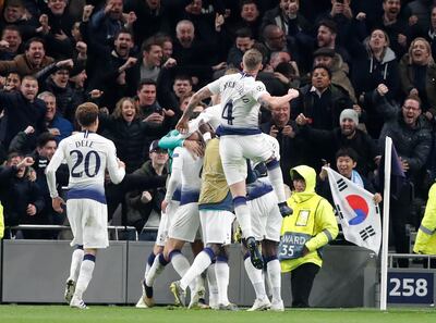 Tottenham's Son Heung-min, covered by teammates, celebrates after scoring during the Champions League, round of 8, first-leg soccer match between Tottenham Hotspur and Manchester City at the Tottenham Hotspur stadium in London, Tuesday, April 9, 2019. (AP Photo/Frank Augstein)