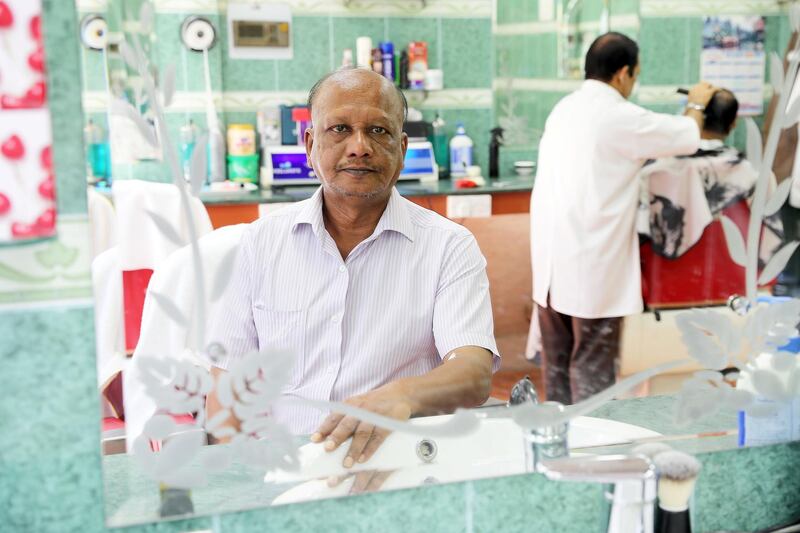 ABU DHABI , UNITED ARAB EMIRATES , NOV 23   – 2017 :- Anil Shill from Bangladesh at his Black House Hairdressing Saloon in Abu Dhabi.  He came to Abu Dhabi as a labourer in 1978. (Pawan Singh / The National) Story by Anna Zacharias 
