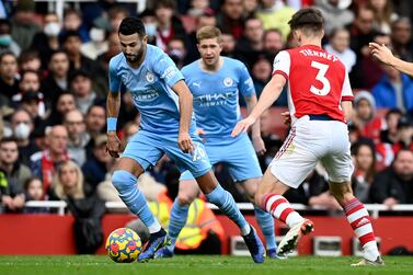 Riyad Mahrez (L) of Manchester City in action against Kieran Tierney (R) of Arsenal during the English Premier League match between Arsenal London and Manchester City in London, Britain, 01 January 2022.   EPA/NEIL HALL EDITORIAL USE ONLY.  No use with unauthorized audio, video, data, fixture lists, club/league logos or 'live' services.  Online in-match use limited to 120 images, no video emulation.  No use in betting, games or single club / league / player publications