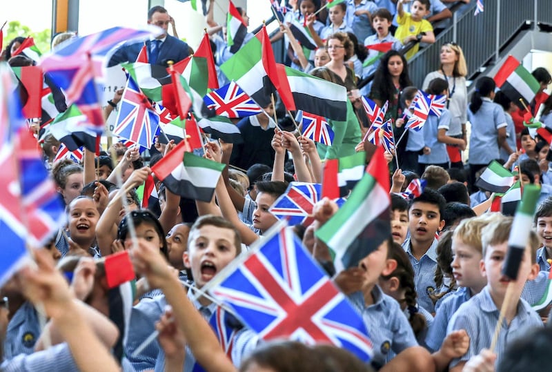 Abu Dhabi, U.A.E., September 24, 2018.  
Launch of 50 year celebrations of British School Al Khubairat.  --  British School students wave the U.A.E. and British flag to greet Principal Mark Leppard and British Ambassador Patrick Moody.
Victor Besa / The National
Section:  NA
Reporter:  Haneen Dajani.