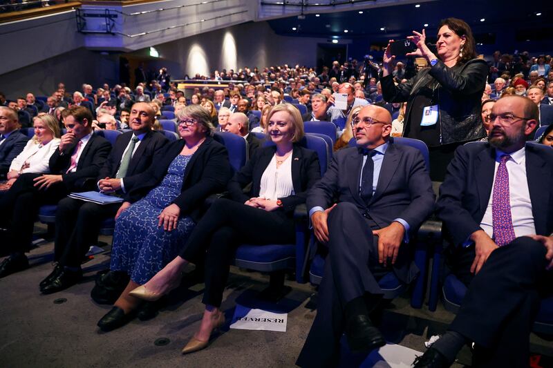 Liz Truss, Chancellor of the Duchy of Lancaster Nadhim Zahawi and Secretary of State for Health and Social Care Therese Coffey listen to Mr Kwarteng speak. Reuters