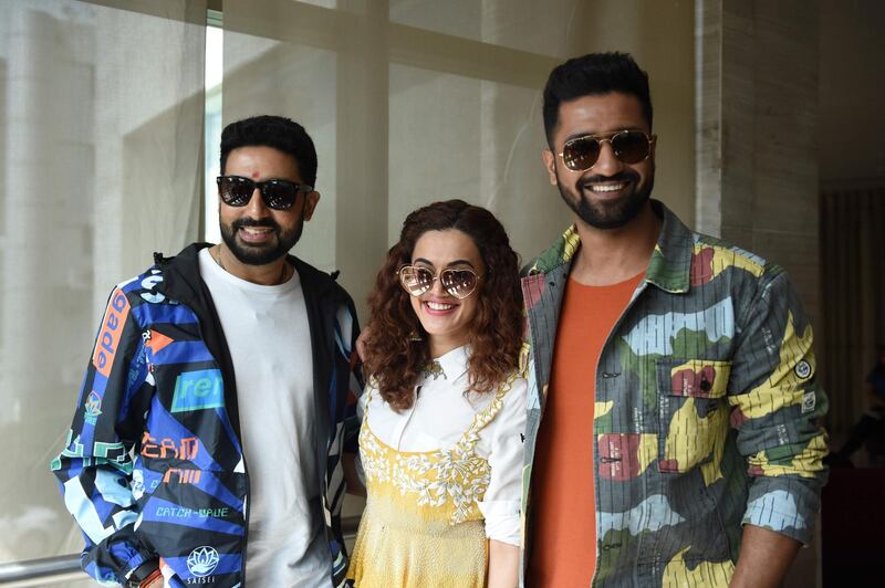 Indian actors Taapsee Pannu(C), Abhishek Bachchan (L) and Vicky Kaushal pose for a picture during a promotional event for the upcoming film 'Manmarizyaan', in Ahmedabad on September 2, 2018. - Actors Vicky Kaushal, Taapsee Pannu, Abhishek Bachchan were in Ahmedabad to promote their forthcoming film 'Manmarziyaan' which is scheduled to be released on September 14. (Photo by SAM PANTHAKY / AFP)