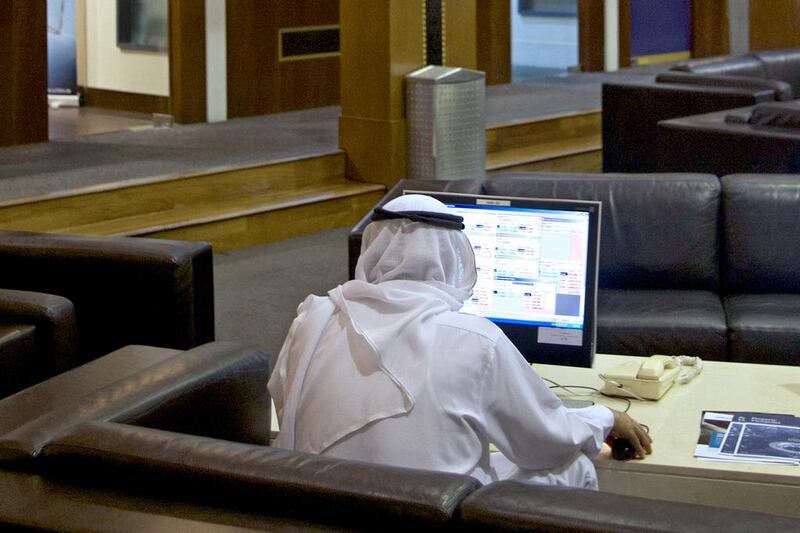 A trader at the Dubai Financial Market. Some emerging market countries now have risk profiles similar to that of a developed country. Kevin Larkin for The National