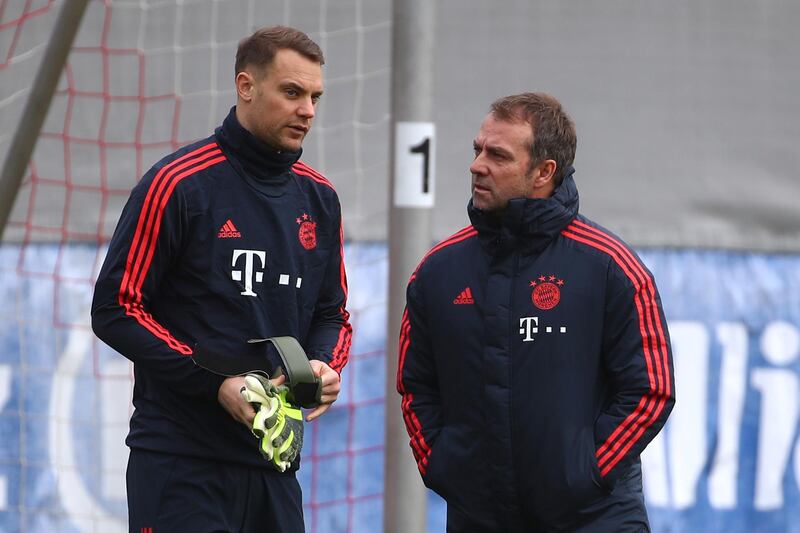 Bayern Munich interim coach Hansi Flick speaks with goalkeeper Manuel Neuer. Reuters