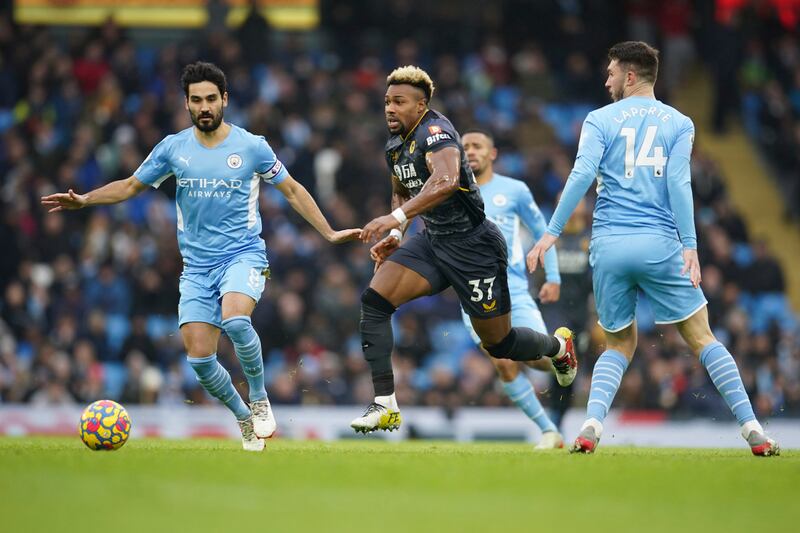 Wolves' Adama Traore runs at the Manchester City defence during the Premier League match at the Etihad Stadium on December 11, 2021. AP