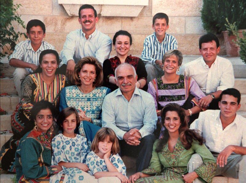 King Hussein, center, and his American-born wife, Queen Noor, sit amongst their 12 children in this picture provided by the Royal Palace in 1995. The picture shows two strong candidates to the Jordanian throne, Prince Abdullah, 36, who sits in the far right in the second row, and his younger brother, Prince Hamzah, 18, top left corner. Prince Abdullah was choosen by royal decree as the new Crown Prince, replacing his Uncle Hassan, Sunday, Jan. 25, 1999. Shortly after King Hussein's triumphant return from cancer treatment abroad he was to die, during a sudden return trip to the United States. Prince Abdullah was proclaimed King, February 2 1999. From top left to right sits Prince Hamzah, Prince Faisal, Princess Alia, Prince Hashem. Second row, Princess Zein, Queen Noor,King Hussein, Princess Aisha, Prince Abdullah. Bottom row, Princess Abeir, Princess Raiyah, Princess Iman, Princess Haya and Prince Ali. (AP Photo) Stand-alone historical filer.