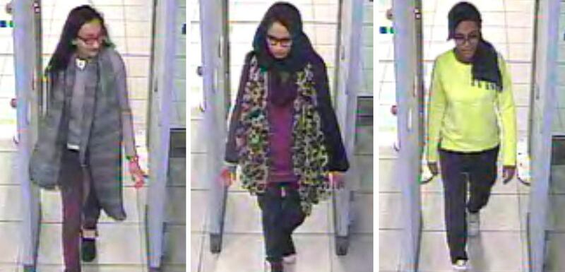 FILE - This Monday Feb. 23, 2015 file handout image of a three image combo of stills taken from CCTV issued by the Metropolitan Police shows Kadiza Sultana, left, Shamima Begum, center, and Amira Abase going through security at Gatwick airport, south England, before catching their flight to Turkey. Shamima Begum told The Times newspaper in a story published Thursday Feb. 14, 2019, that she wants to come back to London. (Metropolitan Police via AP)