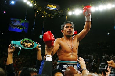 FILE PHOTO: Boxing - Ricky Hatton v Manny Pacquiao IBO Light-Welterweight Title  - MGM Grand, Las Vegas, United States of America - May 3, 2009 Manny Pacquiao celebrates winning the fight  Action Images via Reuters / Andrew Couldridge / File Photo