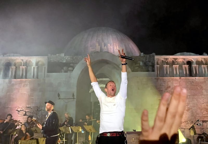 Coldplay front man Chris Martin, right, and guitarist Jonny Buckland, left, perform during a concert at the Citadel in Amman, Jordan. All photos by EPA