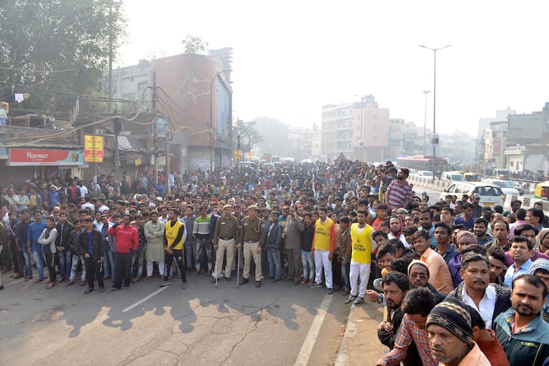 Indian people gather near the site where a fire broke out in New Delhi, India. According to news report, at least 40 people were killed after a  fire broke out at a building in New Delhi's Anaj Mandi area on the morning of 08 December.  EPA