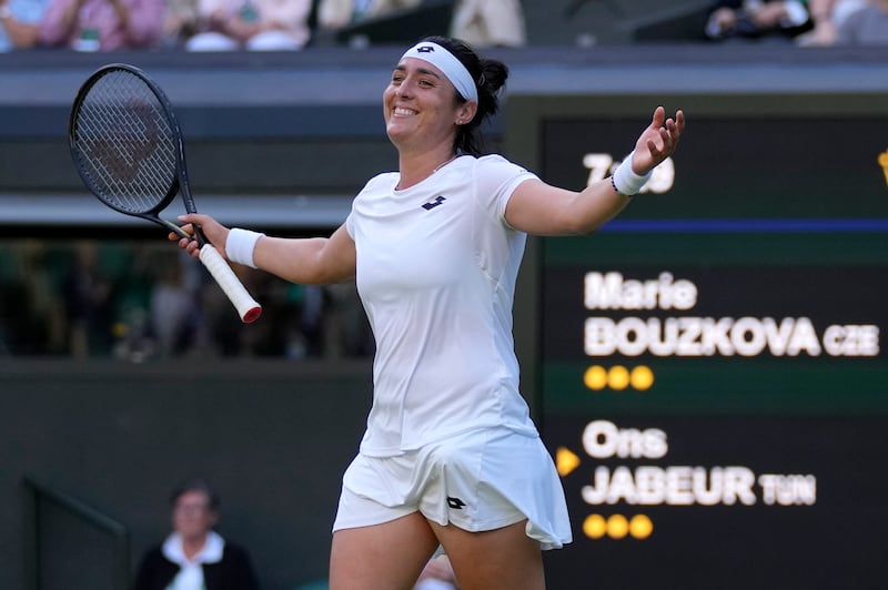 Ons Jabeur celebrates after beating Marie Bouzkova in their Wimbledon quarter-final at the All England Club on Tuesday, July 5, 2022. AP