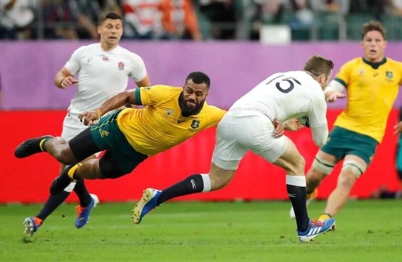 England's Elliot Daly (15) is tackled by Australia's Samu Kerevi during the Rugby World Cup quarterfinal match at Oita Stadium in Oita, Japan. AP Photo