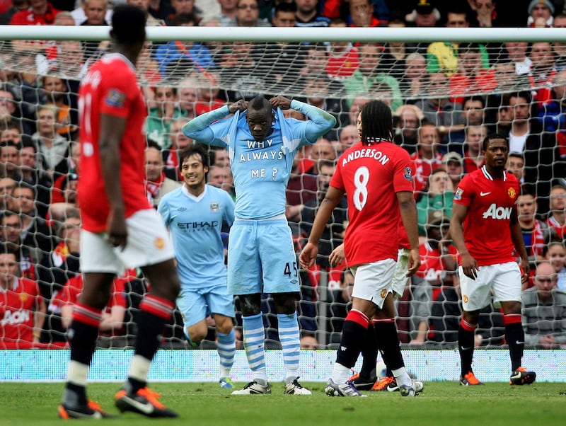 Mario Balotelli scores the first goal during the Manchester derby and celebrates by lifting his shirt to reveal a message directed at himself. 23/10/2011. Lee Smith / FPA / LDY Agency