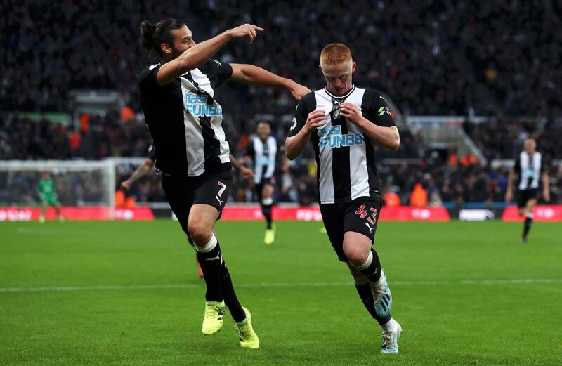 Matthew Longstaff celebrates with teammate Andy Carroll after scoring Newcastle's goal. Getty Images