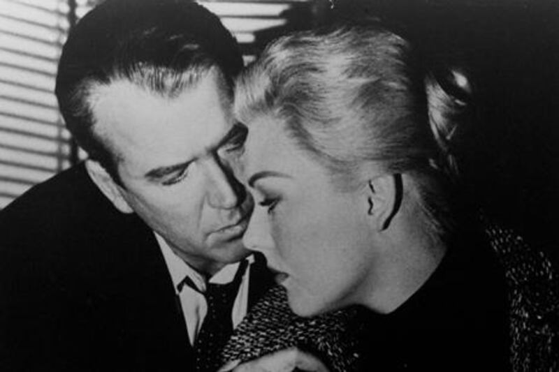 The actress Kim Novak, here in a scene with James Stewart in Alfred Hitchcock’s 1958 film Vertigo, paid for an advertisement in Variety that criticises how The Artist ‘borrows’ from her famous scene, above. Paramount / AP Photo