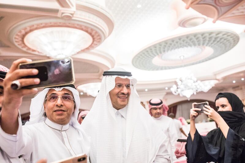 Abdulaziz bin Salman, Saudi Arabia's energy minister, reacts as attendees take photographs during a news conference in Jeddah, Saudi Arabia. The weekend attacks on the kingdom eliminated about 5% of global oil supply -- and raised the risk of more conflict in the region -- propelling Brent crude to a record surge on Monday. Bloomberg