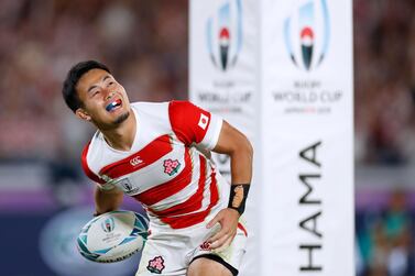 Japan's wing Kenki Fukuoka celebrates after scoring a try during the Japan 2019 Rugby World Cup Pool A match between Japan and Scotland at the International Stadium Yokohama in Yokohama on October 13, 2019. / AFP / Odd ANDERSEN