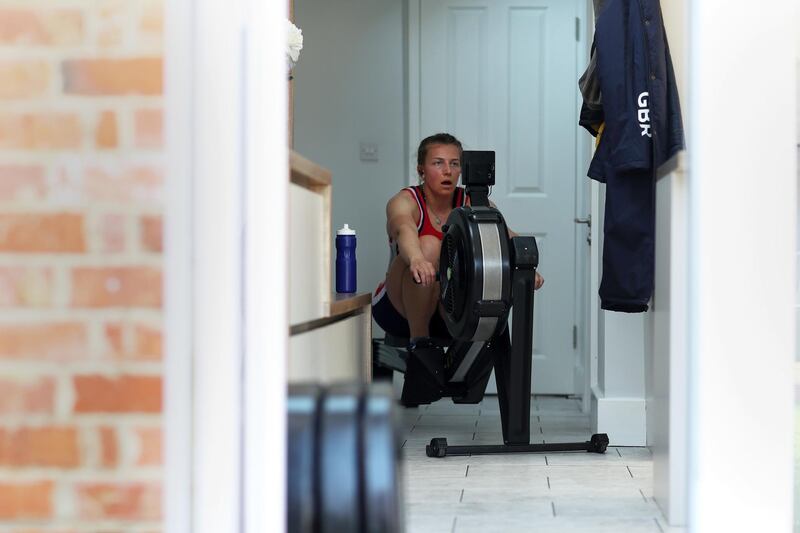 HENLEY-ON-THAMES - MARCH 27: Alice Baatz of Great Britain trains on the ergo 'rowing machine' inside her kitchen on March 27, 2020 in Henley-on-Thames, England. The coronavirus and the disease it causes, COVID-19, are having a fundamental impact on society, government, sports and the economy in United Kingdom. As all sports events in United Kingdom have been cancelled athletes struggle to continue their training as usual. (Photo by Naomi Baker/Getty Images)
