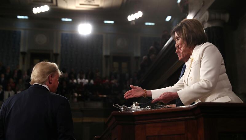 President Donald Trump turns away as Speaker of the House Nancy Pelosi reaches out to shake his hand as he arrives to deliver his State of the Union address to a joint session of the US Congress in the House Chamber of the US Capitol in Washington, US. Reuters