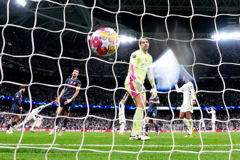 Manchester City goalkeeper Stefan Ortega watches the ball in the net after Federico Valverde scores Real Madrid's third goal. AP