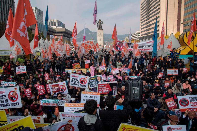 Anti-Trump protesters demonstrate in Gwanghwamun square in central in Seoul. Ed Jones / AFP Photo