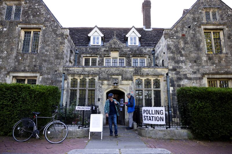 Voters leave a polling station in Lewes, east Sussex, after casting their ballots. Reuters