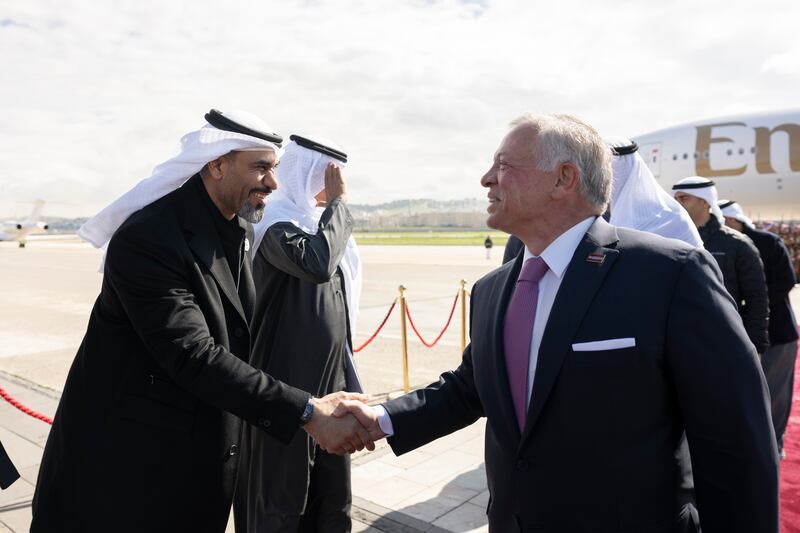 Humaid Abu Shabas, chairman of the UAE Accountability Authority, greets King Abdullah at Marka International Airport.