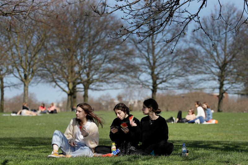 Groups of people picnic in Hyde Park in London. AP Photo