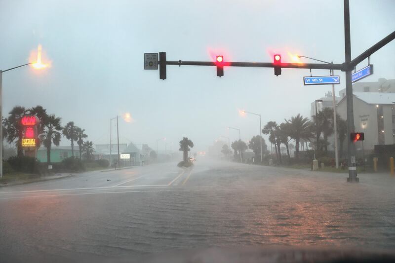Water floods a road as the outer bands of Hurricane Sally come ashore in Gulf Shores, Alabama. AFP