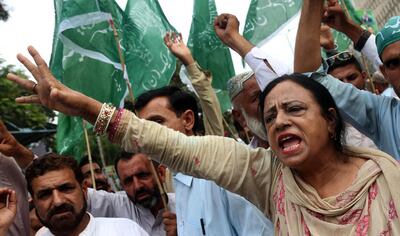 epa06915895 Supporters of Pakistan Muslim League Nawaz (PMLN) party which recently concluded its mandate shout slogans during a protest against alleged rigging in general elections, in Karachi, Pakistan, 28 July 2018. Pakistan's outgoing ruling party joined a dozen other parties on 27 July in announcing protests to demand a re-do of this week's general elections, rejecting preliminary results that point to victory for the party of retired cricket great Imran Khan.  EPA/REHAN KHAN