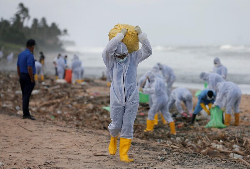 Bags of debris being removed from a beach in Ja-Ela, Sri Lanka. Reuters