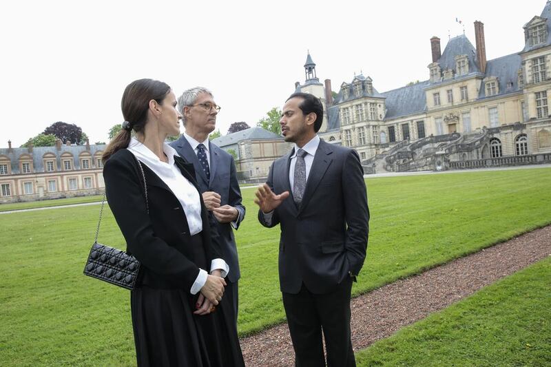 Sheikh Sultan bin Tahnoon, with the French culture minister Aurelie Filippetti, left, and Jean Francois Hebert, centre, the president of the Public Establishment of Fontainebleau.