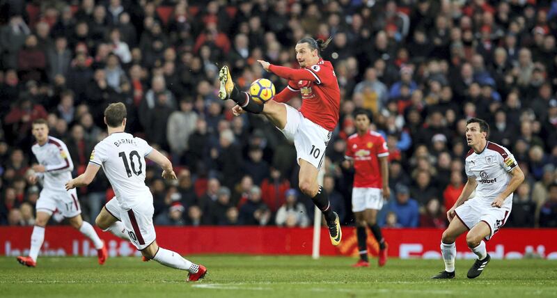 Soccer Football - Premier League - Manchester United vs Burnley - Old Trafford, Manchester, Britain - December 26, 2017   Manchester United's Zlatan Ibrahimovic in action with Burnley's Ashley Barnes and Jack Cork           REUTERS/Andrew Yates    EDITORIAL USE ONLY. No use with unauthorized audio, video, data, fixture lists, club/league logos or "live" services. Online in-match use limited to 75 images, no video emulation. No use in betting, games or single club/league/player publications.  Please contact your account representative for further details.