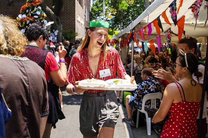 Volunteer Christian Wilkins hands out plates at the Wayside Chapel Christmas Lunch in Sydney, Australia. Getty Images
