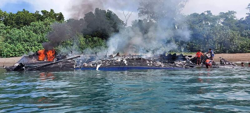 The burnt out shell of a ferry near Real town, the Philippines, after a fire ripped through the vessel on Monday, killing at least seven people. AFP