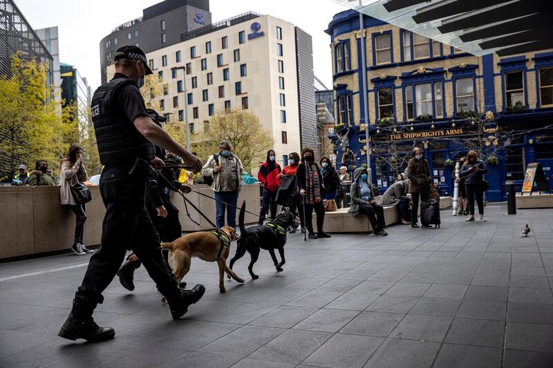 LONDON, ENGLAND - APRIL 21: Police dogs and handlers pass commuters as they enter London Bridge Station on April 21, 2021 in London, England. Police officers attended London Bridge station after reports of a suspicious item aboard a train.  (Photo by Rob Pinney/Getty Images)