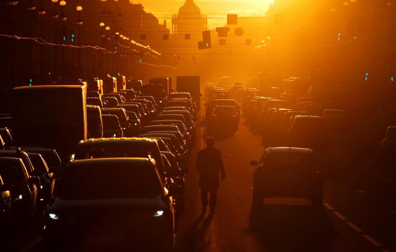 A pedestrian walks in between lines of traffic along Nevsky Avenue in St Petersburg, Russia. Reuters