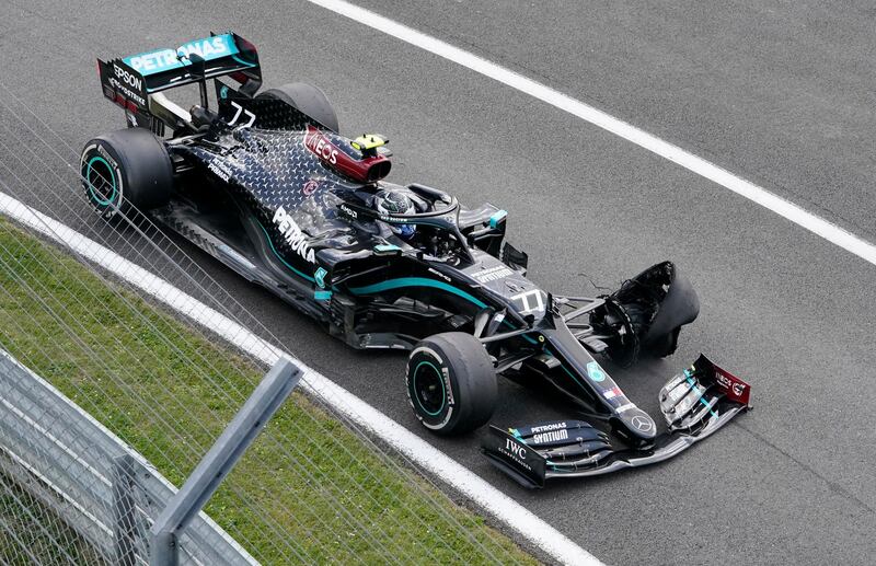 Mercedes' Valtteri Bottas suffers a puncture with two laps to go at the British GP. Reuters