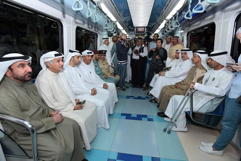 Dr Thani Al Zeyoudi, Minister of Climate Change and the Environment, Abdullah Al Basti, Secretary-General of the Executive Council in Dubai, and Hussain Lootah, director general of Dubai Municipality, take the metro on Car Free Day. Courtesy Dubai Municipality