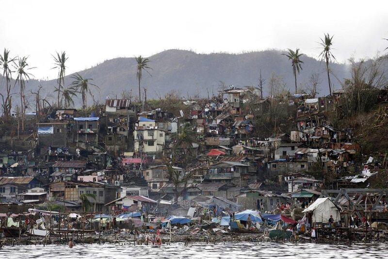 Damaged houses are seen in the super typhoon devastated city of Tacloban, Leyte province, Philippines. The United States will send an aircraft carrier and other Navy ships along with 20 million US dollar in emergency humanitarian aid to the Philippines. Dennis M Sabangan / EPA