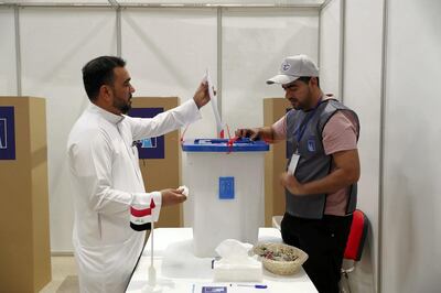 DUBAI , UNITED ARAB EMIRATES , MAY 10 – 2018 :- One of the voter casting his vote during the Iraq elections voting held at Qalaat Al Remaal hall on Dubai – Al Ain road in Dubai.  ( Pawan Singh / The National )  For News. Story by Nawal
