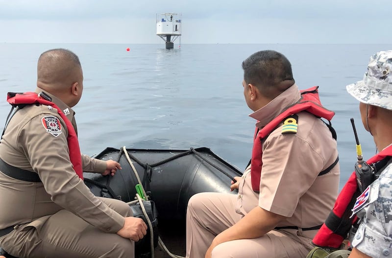 epa07513234 A handout photo made available by the Royal Thai Navy (RTN) shows Thai naval officers from the Third Naval Area Command and Marine policemen inspecting a 'Seastead', a floating 'living platform' in the Andaman Sea, some 12 nautical miles off the coast of Phuket island, southern Thailand, 13 April 2019 (reissued 18 April 2019). According to media reports, Bitcoin entrepreneurs US national Chad Andrew Elwartowski and his Thai wife Supranee Thepdet, have gone into hiding as they fear that they may have to face death penalty after building a home on a platform in international waters close to Thailand's coast with the intent to set up a permanent outpost out of any state territories.  EPA/ROYAL THAI NAVY HANDOUT  HANDOUT EDITORIAL USE ONLY/NO SALES