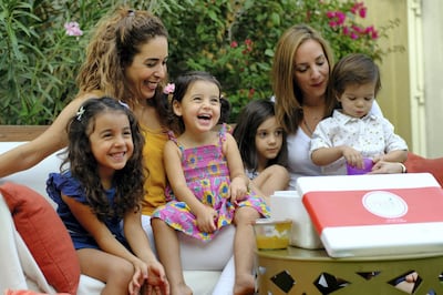 Sprout co-founders Ozlem Erbas Soydaner, left, and Katerina Papatryfon, with their children 
