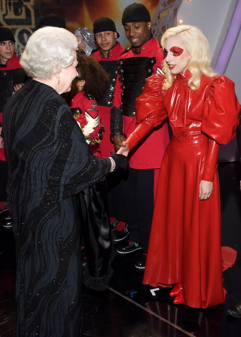 BLACKPOOL, UNITED KINGDOM - DECEMBER 7:  Queen Elizabeth II meets singer Lady Gaga following the Royal Variety Performance on December 7, 2009 in Blackpool, England  (Photo by Leon Neal/ WPA Pool /Getty Images)
