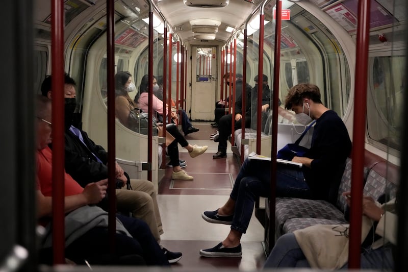 Most passengers on an underground train on London's Bakerloo Line wear masks as a precaution against Covid-19. AP